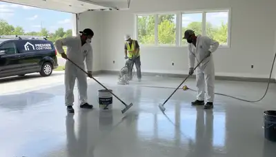 Epoxy floor coating in Long Beach CA garage with durable, glossy finish by professional painters