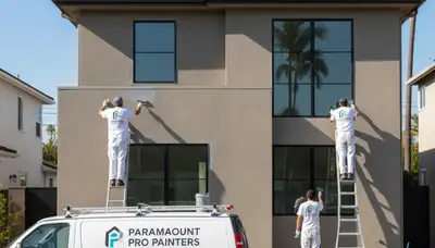 Professional house painters working on exterior home in Long Beach, CA