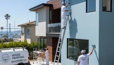 Professional house painters working on coastal home exterior in Long Beach, CA