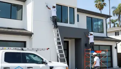 Professional house painters in Long Beach CA painting exterior home siding